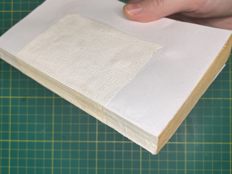 Adding fabric to the book for strength